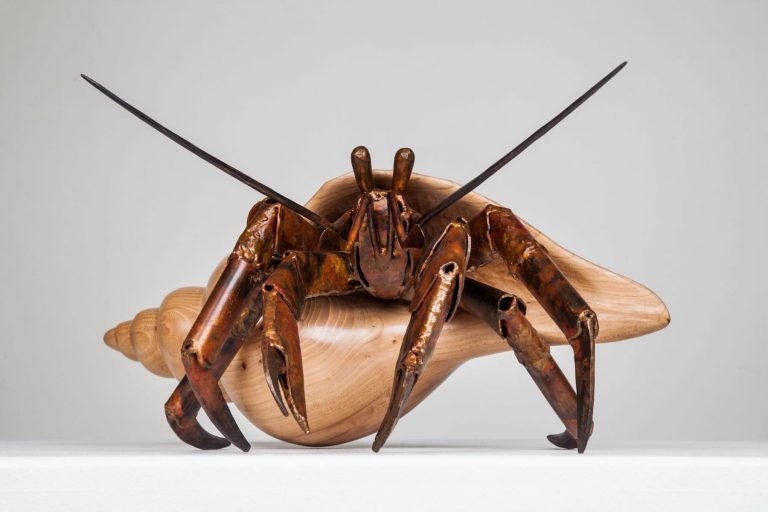 wood and bronze hermit crab laguna beach