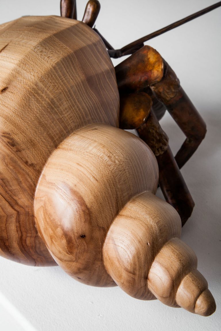 wood and bronze hermit crab laguna beach