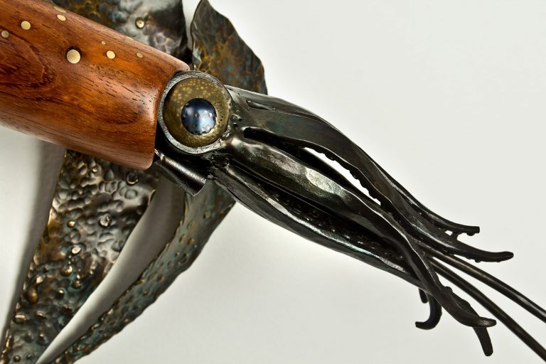 metal and wood squid sculpture laguna beach