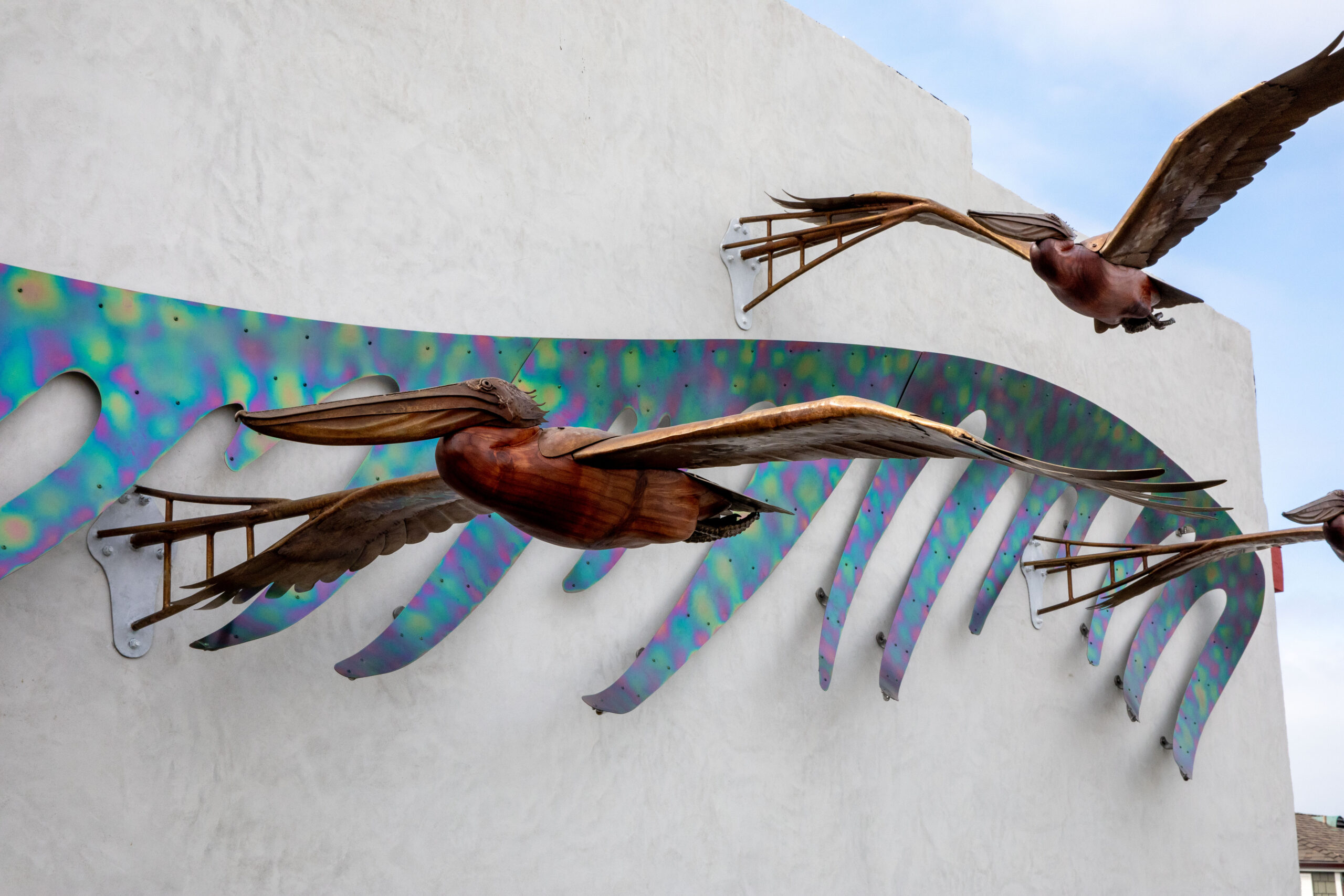 Redwood pelicans with bronze wings public art Laguna Beach