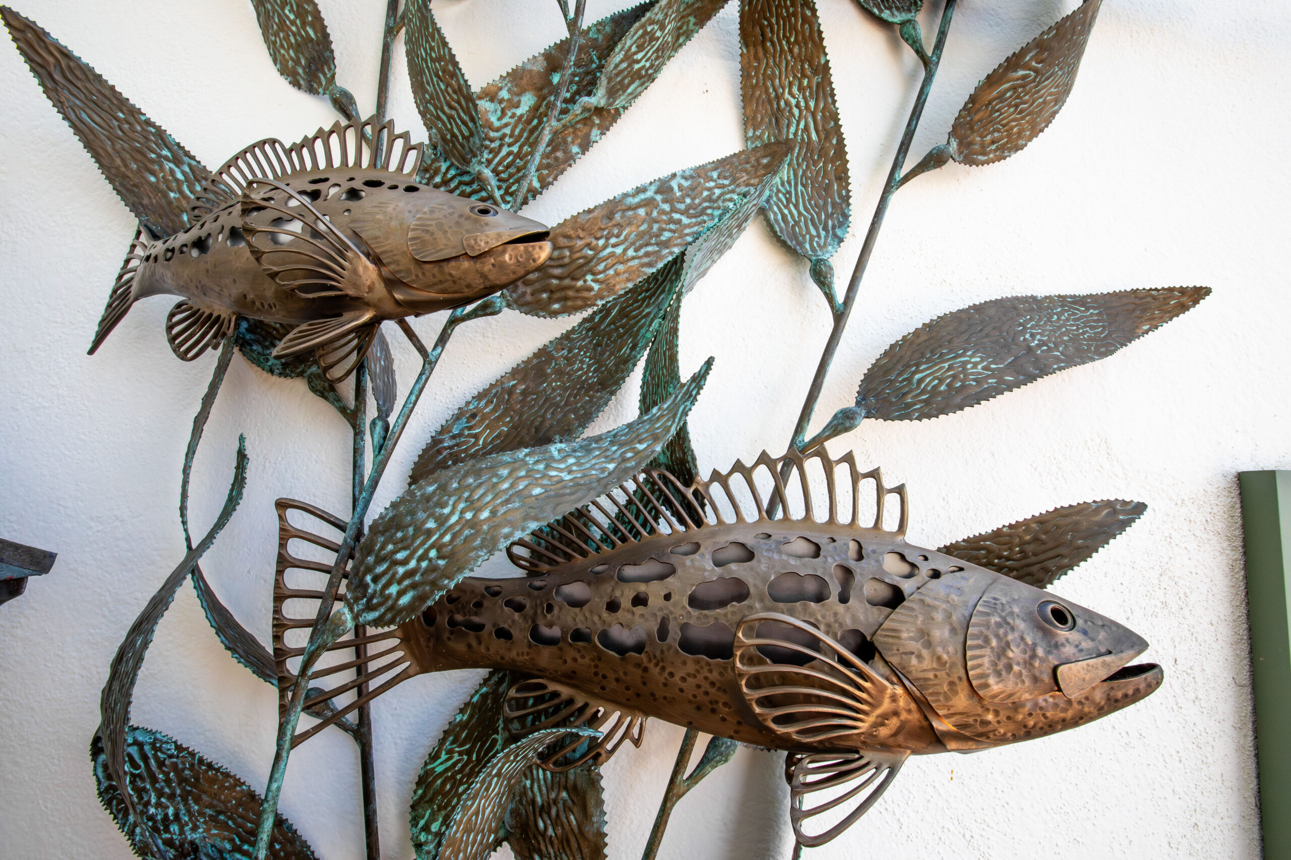 Hammered and welded bronze calico bass sculpture